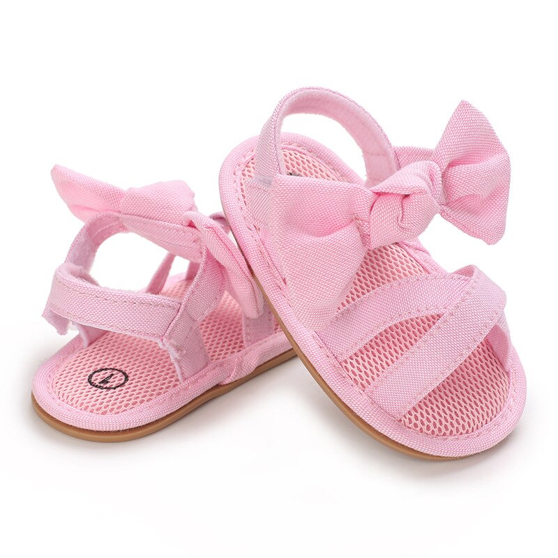 Scarpe da bambina per bambini sandali piatti per bambini sandali suola in gomma morbida Premium antiscivolo fiocco estivo punta d'onda pizzo scarpe da passeggio