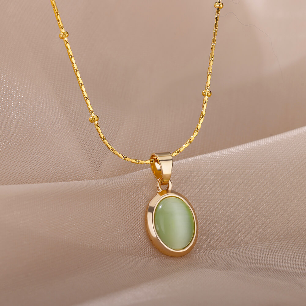 Ovale ketting met opaalsteen voor dames, gemaakt van roestvrij staal met een gouden ovale stenen hanger, ideaal voor een bruiloft.