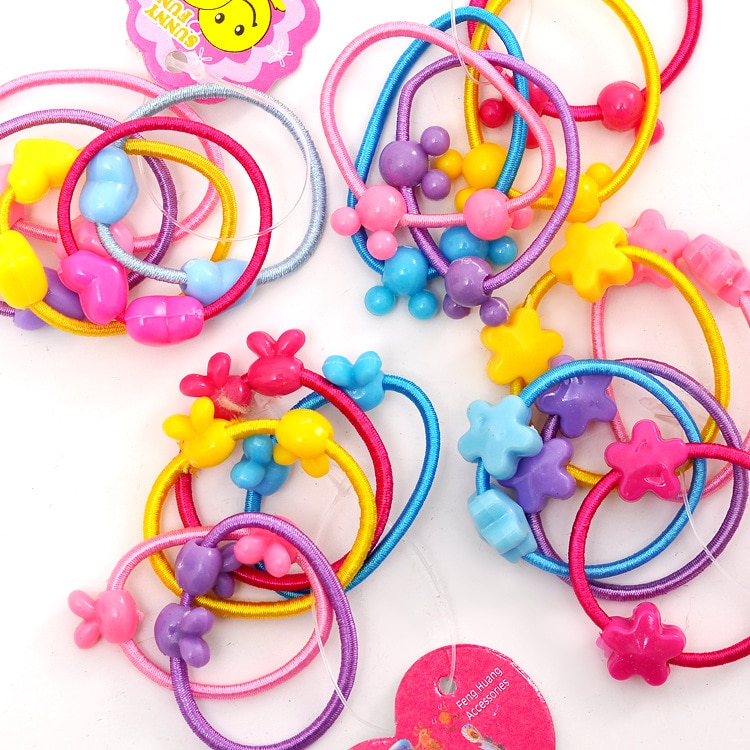 20 stk / lot tegneserie plast elastikker børns tegneserie slik farve gummibånd pige hår tilbehør hovedbeklædning børn fødselsdag gif