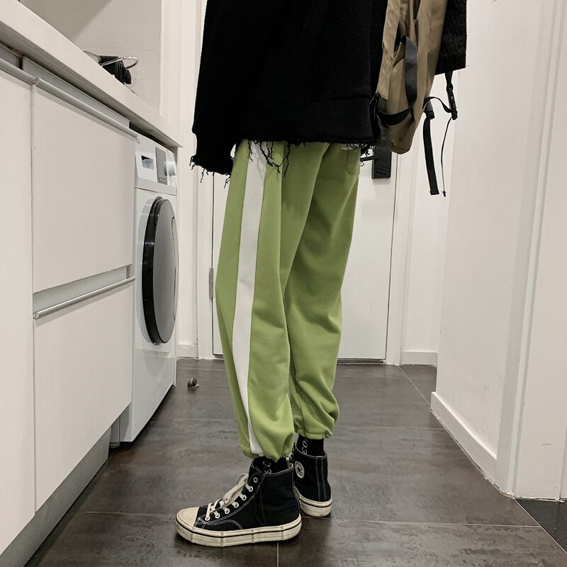 Verkkarit miesten hittivärit rento lenkkeilyhousut miesten katuvaatteet villi löysät hip hop suorat housut miesten verryttelyhousut