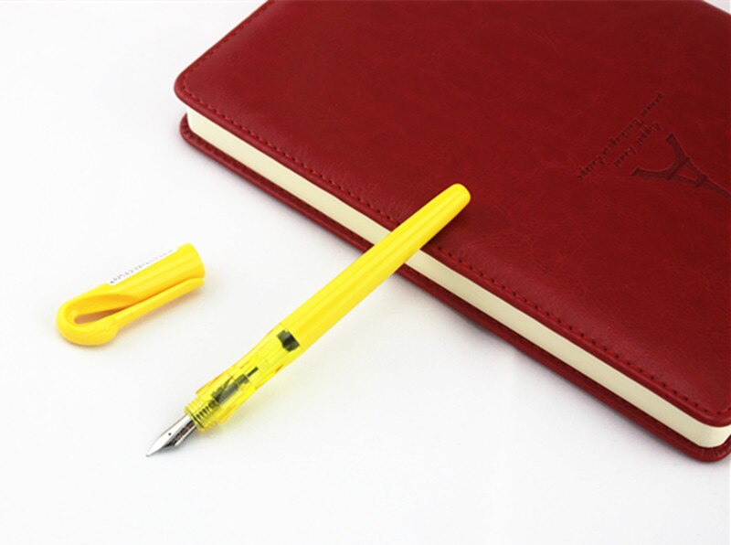 JINHAO-pluma estilográfica de metal swan de , pluma transparente de tinta de 0,5mm, papelería, suministros escolares de oficina, para nuevos estudiantes: yellow