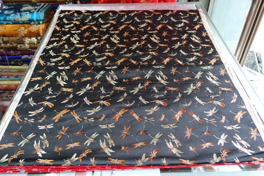 chinese traditional silk brocade fabric black back with yellow and light gold colorful dragon fly dragonfly pattern