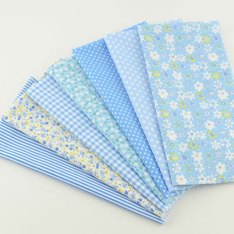 Boekenweef katoenen stof lichtblauwe kleur diverse fat quarter kussen quilten meter naaien textiel weefsel patchwork gordijn