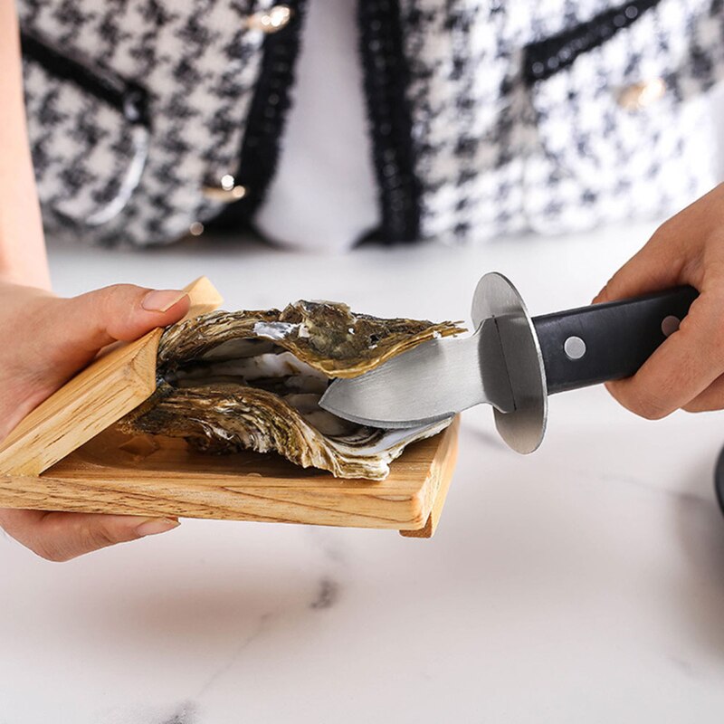 Stainless steel oyster knife with cut resistant gloves