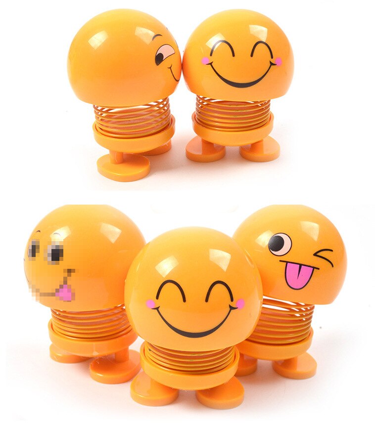 Śmieszne słodkie lalki twarzy pouruszająca głową lalka w samochodzie kreatywny samochód słodkie ozdoby wiosenne wyrażenie