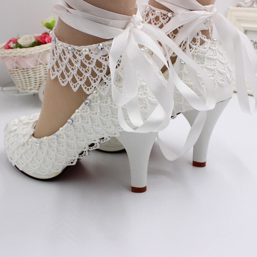 lace-high-heeled-wedding-shoes-white-wedding-dress-grandado
