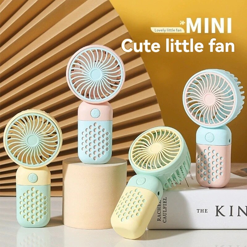 2025 draagbare oplaadventilator Cartoon schattige kleine student Opladen kleine ventilator Draagbare mini-USB-ventilator Mini-zak
