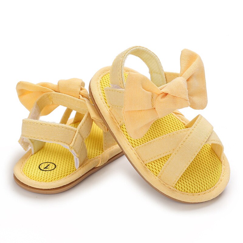 Scarpe da bambina per bambini sandali piatti per bambini sandali suola in gomma morbida Premium antiscivolo fiocco estivo punta d'onda pizzo scarpe da passeggio