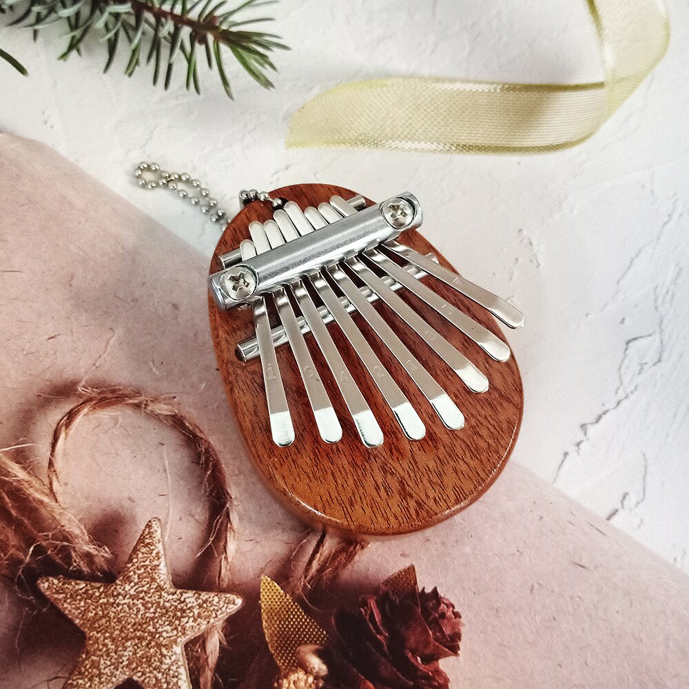 Mini Kalimba de 8 teclas, Piano de pulgar, teclado de dedo con sonido excelente, instrumento Musical, accesorio bonito, colgante, para niños, novia