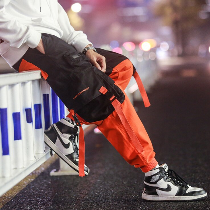 Hombres suelta ropa informal estilo Hip hop coreano pantalones Harem con bolsillo pantalones de tobillo de longitud de remiendo Casual Cargo pantalones de chándal