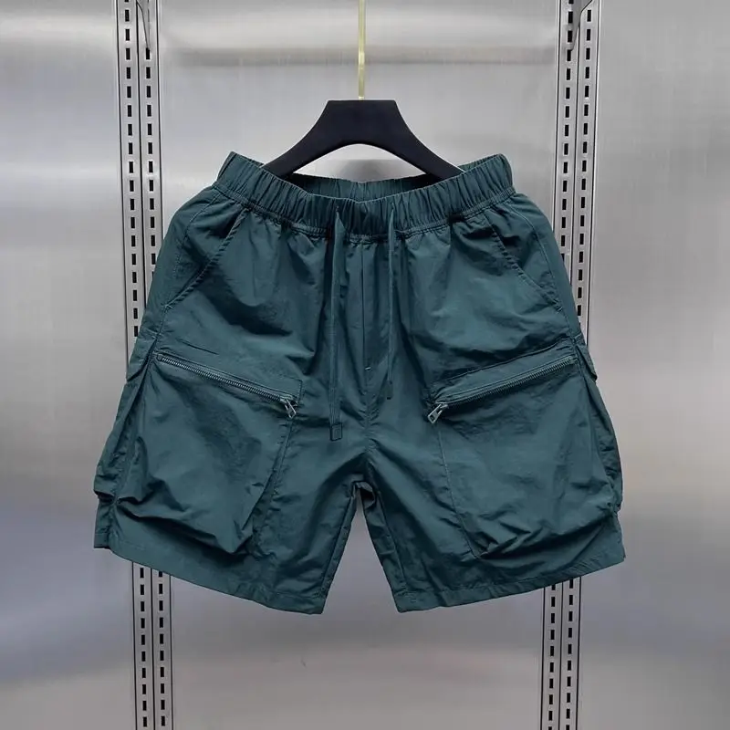 Højtaljede cargoshorts til kvinder sommer tynde, løse, hurtigttørrende shorts med brede ben, koreanske, solide sportsshorts med snøre: L / Blå