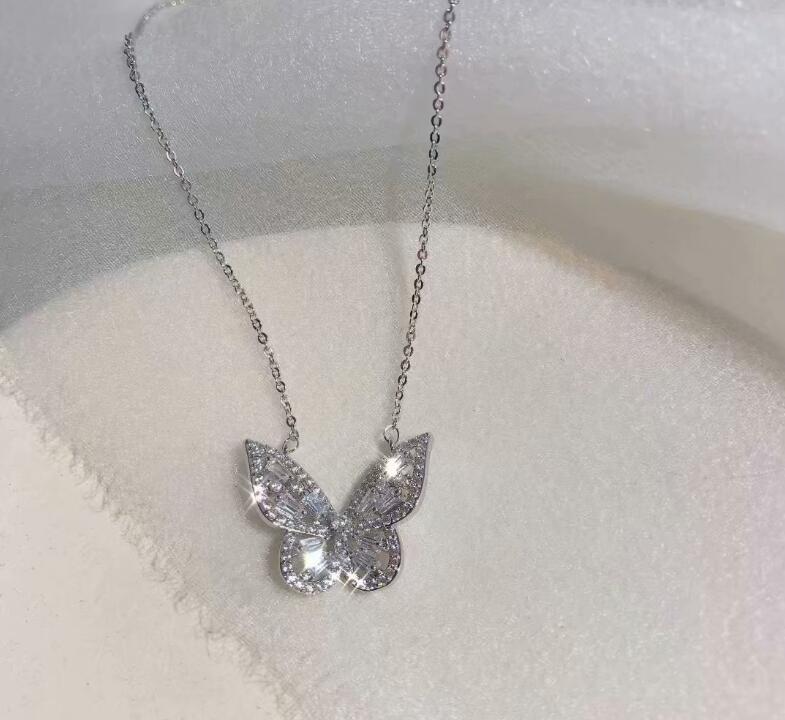 Femmes de luxe à la brillant strass boucle d'oreille gemme papillon anneau collier ensemble de bijoux