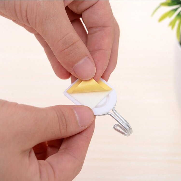 Gancho pequeño de trompeta de plástico blanco de dibujos animados, fuerte adhesivo para cocina, accesorios de baño, toalla, bolso de mano, colgador de pared, 1 ud.