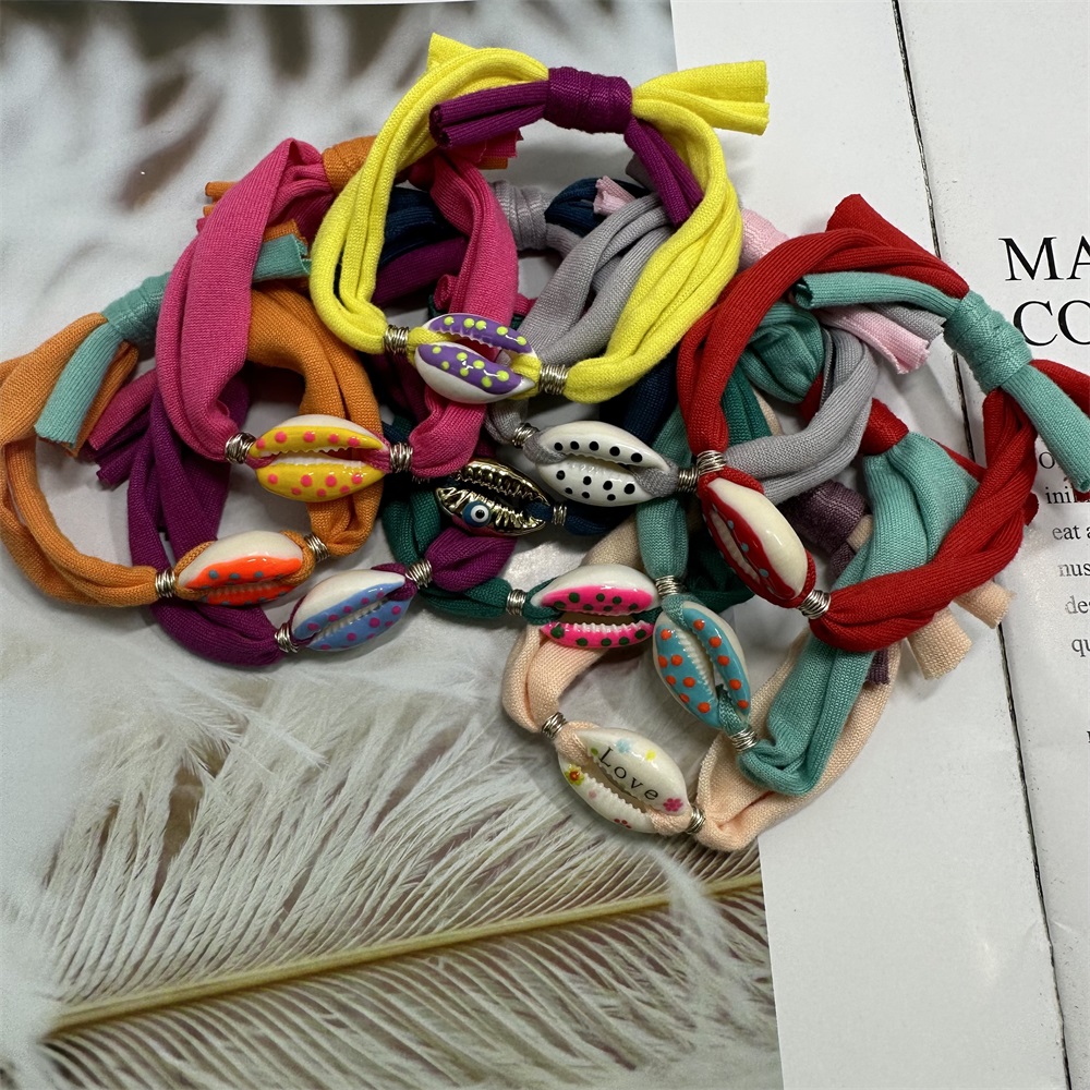 Bracciale con ciondoli a conchiglia a pois Linea di cotone colorata Braccialetti con corde intrecciate fatte a mano per gioielli da donna, uomo e bambino