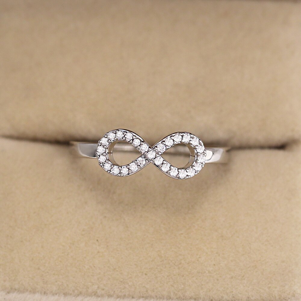 Anel de aço inoxidável para mulheres, anel de símbolo do infinito simples com anel de zircônio, cor prata, strass, presente de joias