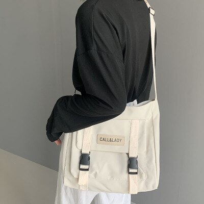 Mochila escolar de lona resistente al agua de nailon, bolso de mensajero sencillo de estilo japonés a la , bolso de cartero coreano: Blanco