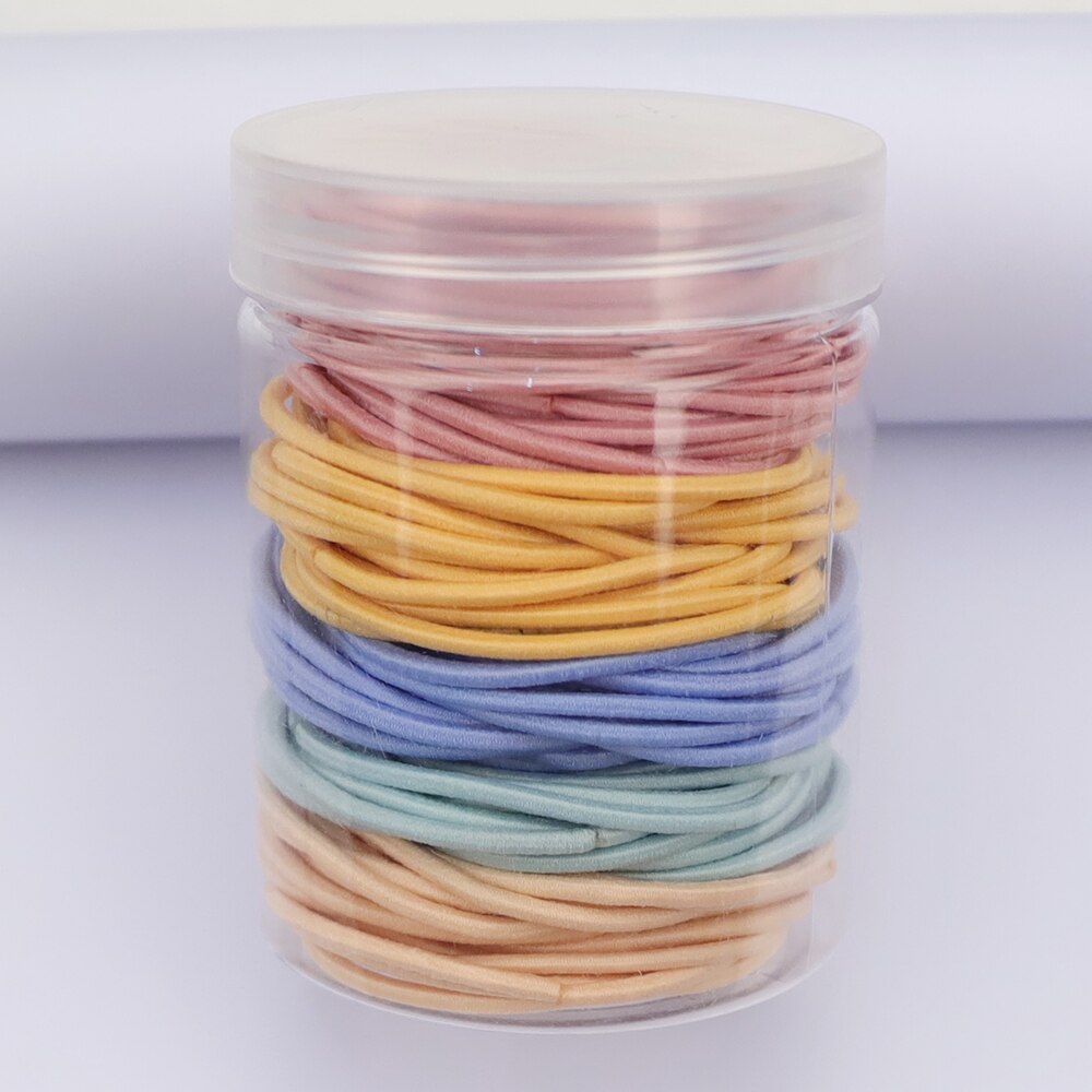 Gomas elásticas de goma para el pelo para niñas y mujeres, gomas finas de colores de 2MM de grosor, accesorios básicos para el cabello, goma bonita para el pelo, botella de 4CM, 100 Uds.: Cream color 1