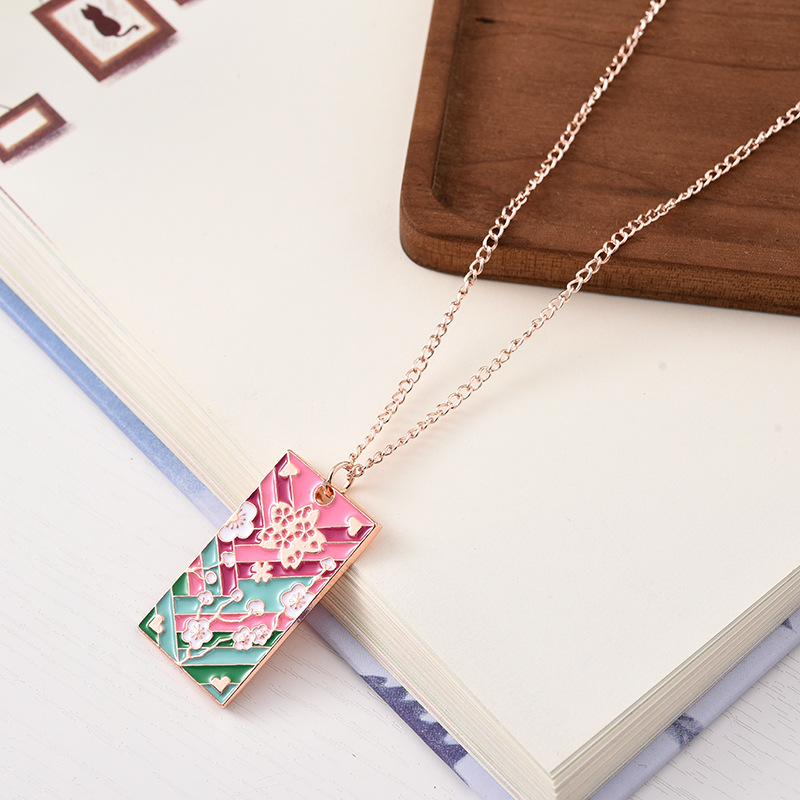 Collier Anime Demon Slayer Kamado Tanjirou Nezuko Agatsuma Zenitsu, pendentif en métal, accessoires de Cosplay, bijoux pour hommes et femmes: Rouge