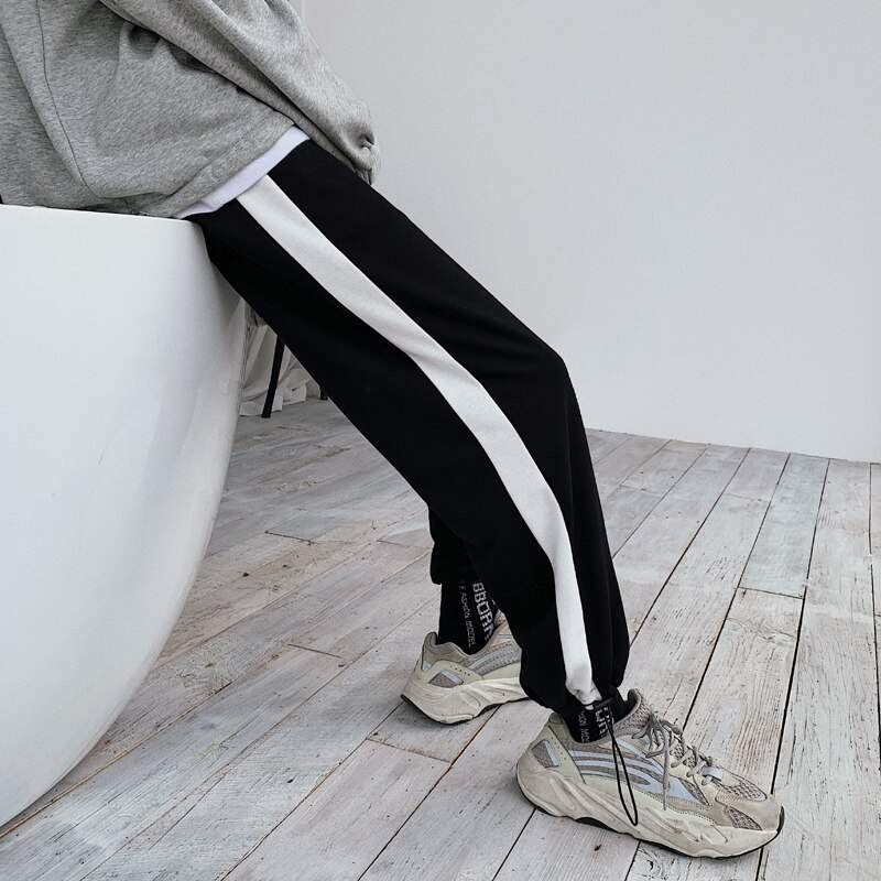 Verkkarit miesten hittivärit rento lenkkeilyhousut miesten katuvaatteet villi löysät hip hop suorat housut miesten verryttelyhousut