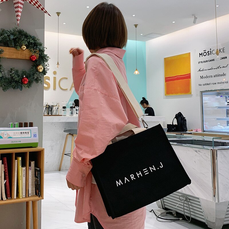 Doudou Maehen. J letter Canvas Handbag Korean portable Messenger Bag Canvas zipper bag multi color spot