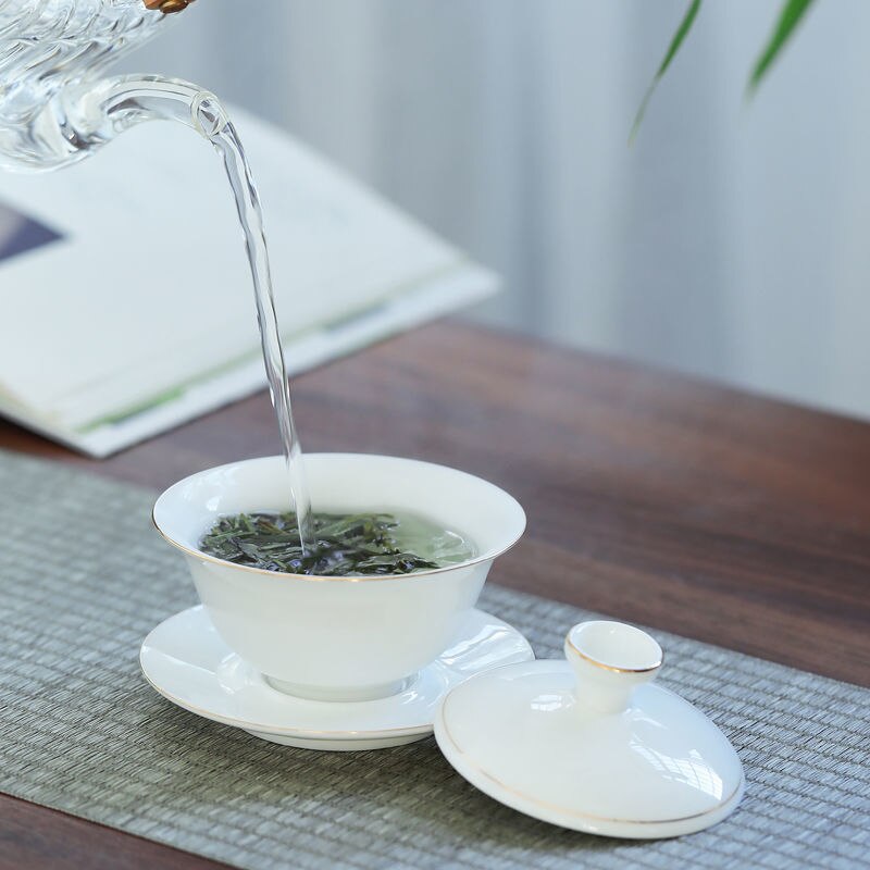 Tueen-cuenco de té de Jade, Taza de cerámica grande con contorno de porcelana blanca en dorado, para infusiones, Kung Fu