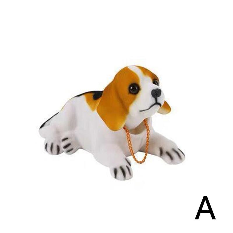 Dukke nikkende hund ryster på hovedet harpiks simulation bil hundelegetøj instrumentbræt dekoration bil ornament sød bil tilbehør: -en