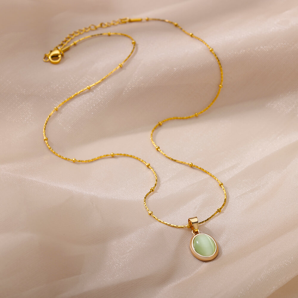 Ovale ketting met opaalsteen voor dames, gemaakt van roestvrij staal met een gouden ovale stenen hanger, ideaal voor een bruiloft.