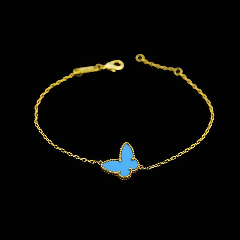 Guldfarvet sommerfuglearmbånd til kvinder: Blå turkis
