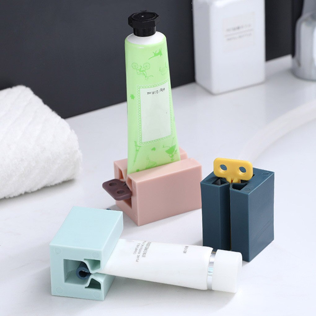 Nouveaux accessoires de salle de bain presse-dentifrice distributeur de pâte à dents presse-Tube nettoyant pour le visage presse support roulant pour enfants