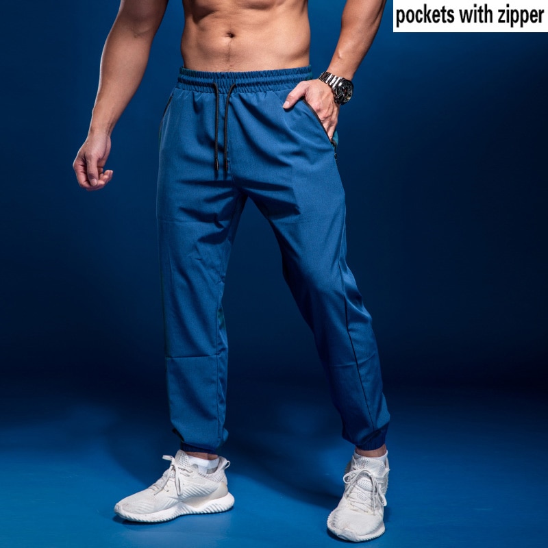 Bintuoshi menn sport løpebukser fotball treningsbukser med glidelåslommer jogge Fitness treningsstudio bukser trening sport bukser 2: Blå / Xl (170-175cm)