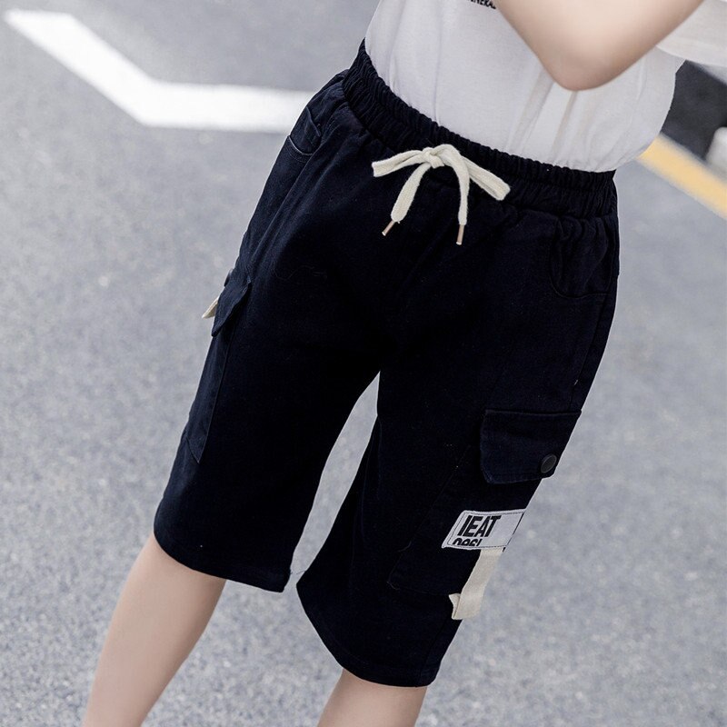 Sommar barns fritidsshorts pojkar flickor enfärgad resår i midjan korta byxor unisex barn strandshorts för 5-13 år: Svart / 13