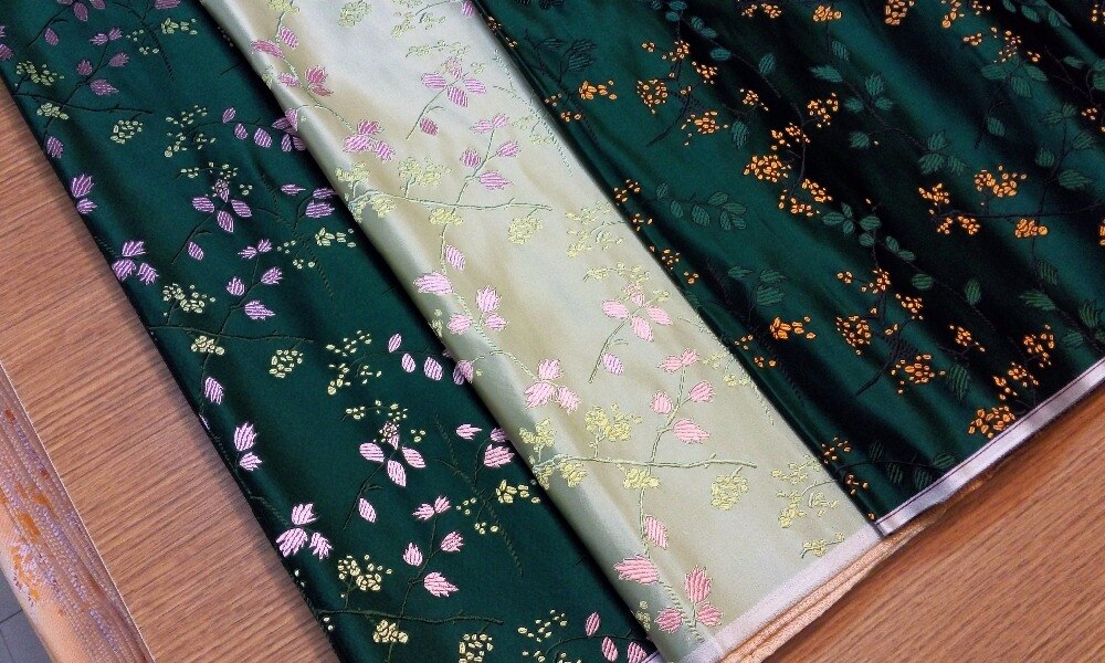 chinese silk brocade woven damask damask fabric cheongsam cushion dark green back with gold seeds and pink leaf pattern