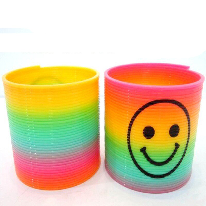 10 pz/impostato anti-fatica Magia di Sorriso di Plastica Arcobaleno Primavera Cerchio Colorato Bobina Elastico Anello di Giocattoli Educativi per I Giochi per Bambini