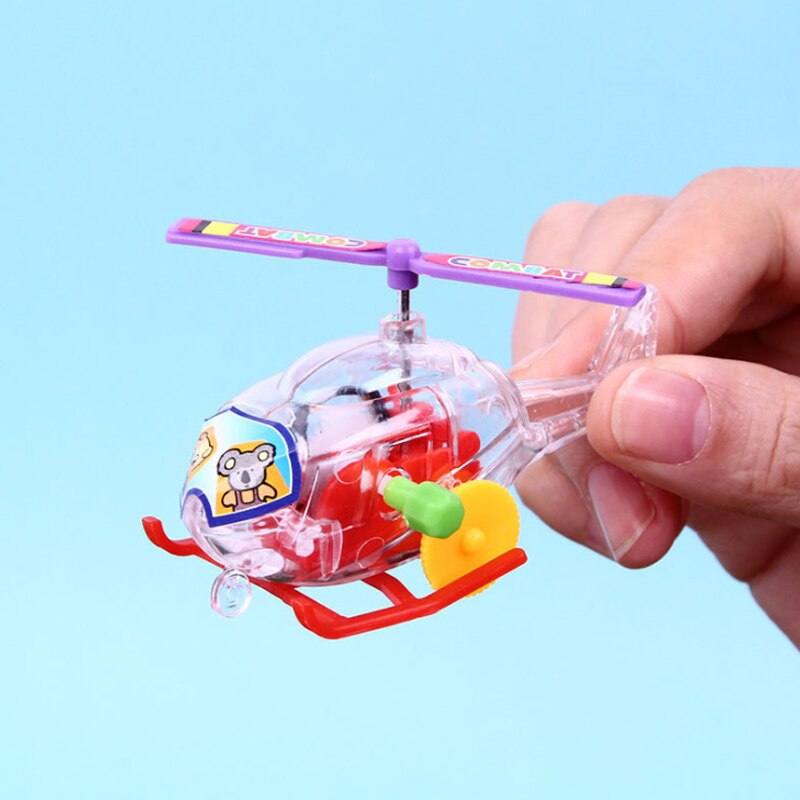 1 stuk en interessant opwindbaar speelgoed met uurwerk, transparant mini-vliegtuig, helikopter, terugtrekspeelgoed voor kinderen en baby's.