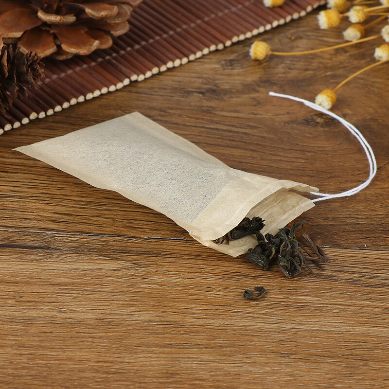 100 st / parti pappers tepåsar filtrerar tomma tesäckar med dragsko för ört löst te