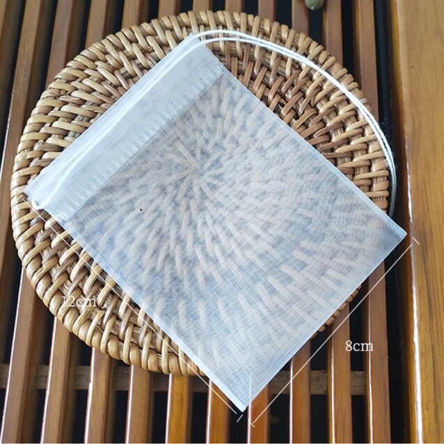100 st/lot tom tepåse nylonmaterial tepåsar med snöre läka tätning filterpåse papper för ört löst te 5 storlekar: 8 x 12cm