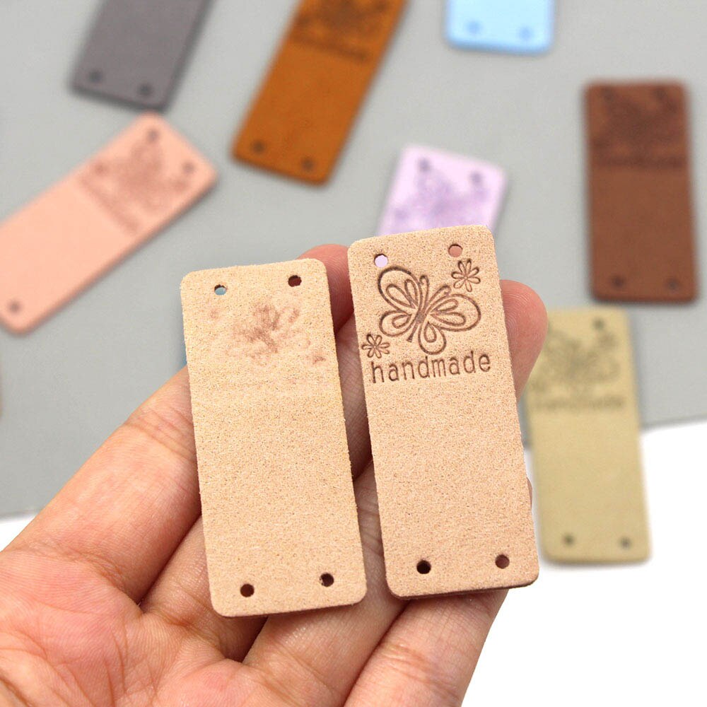 Etichetta fatta a mano farfalla 20 pezzi etichette in pelle per abbigliamento etichette fatte a mano per cucito cappello fai da te accessori per cucire 2x5CM 10 colori