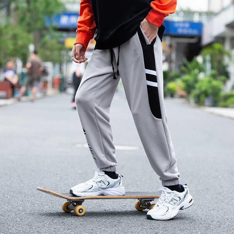 Streetwear løse mænd bukser udendørs sportsbukser ankel bundet mellem talje elastik mandlig hip-hop bogstav efterår lange bukser