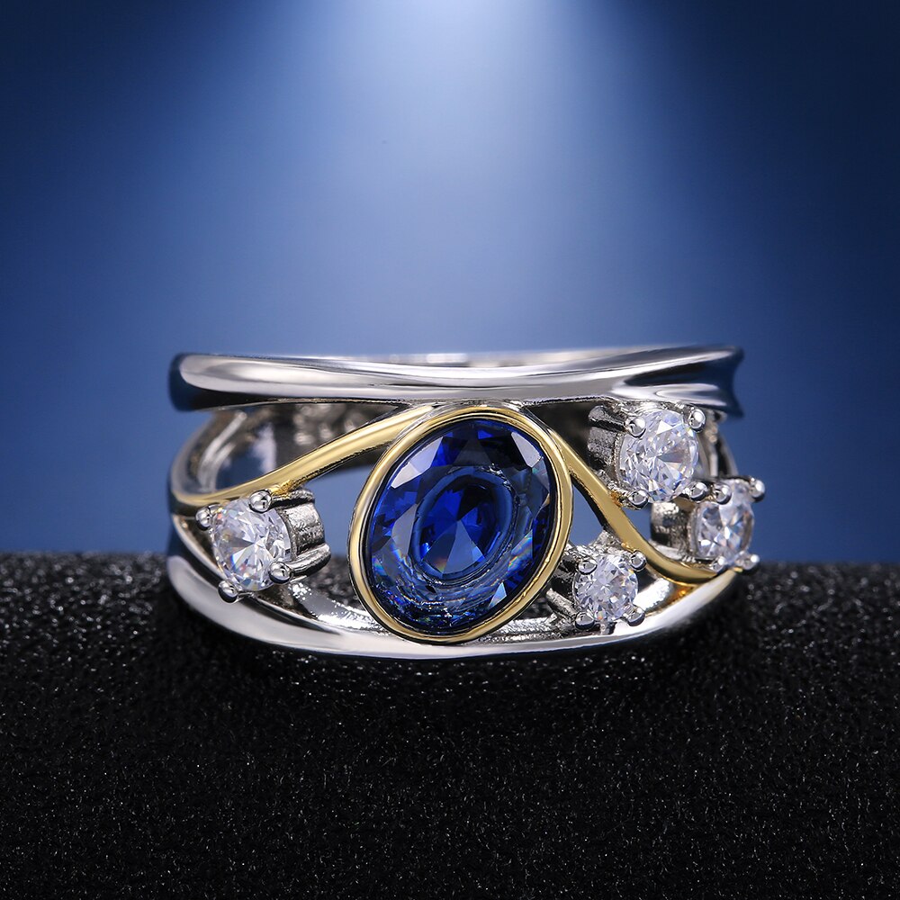 Huitan WunderschöNe Aushöhlen Frauen Finger Ring Oval Blau CZ Stein blendend Hochzeit Braut Ring Tanzen Party Zubehör