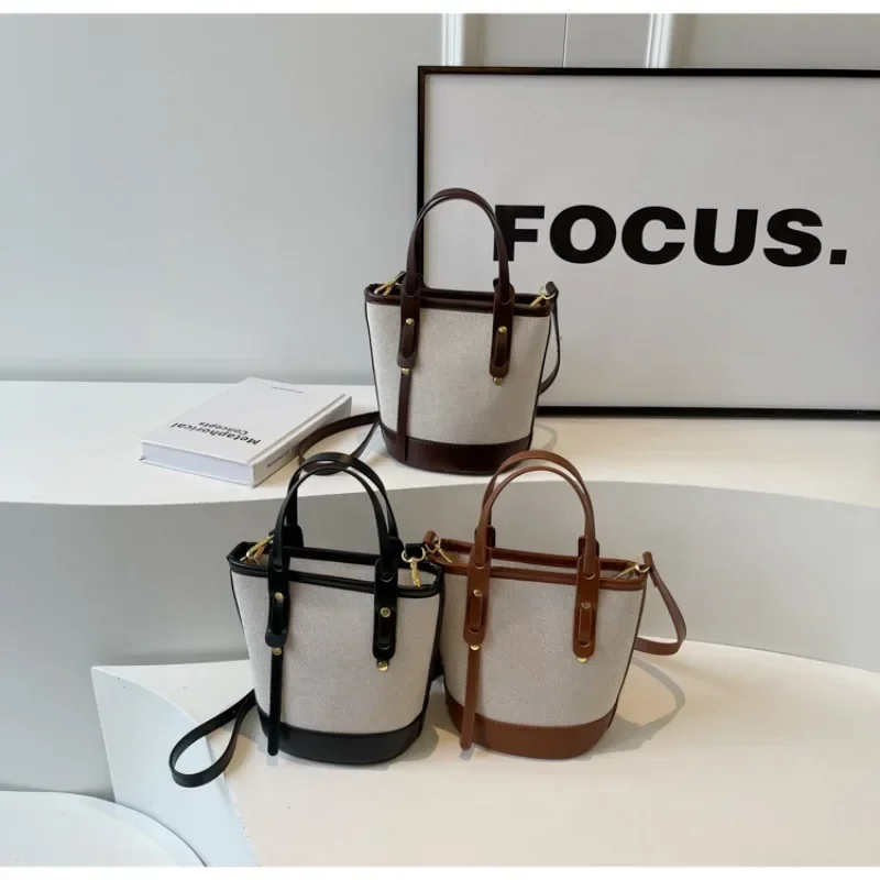 2025 polyvalent PU toile seau épaule et sacs à bandoulière Simple décontracté sens du luxe rétro sacs à main pour les femmes