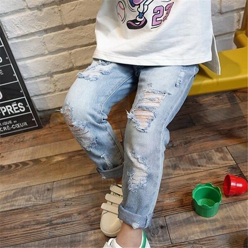 Moda bambini Jeans strappati Jeans pantaloni Jeans per ragazze pantaloni in Denim per ragazzi Jeans per bambini pantaloni in Denim rotto per bambini vestiti per bambini