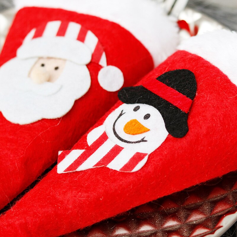 Kerstversiering kerstmuts dao cha tao mes en vork tas kersttafel feestdecoratie