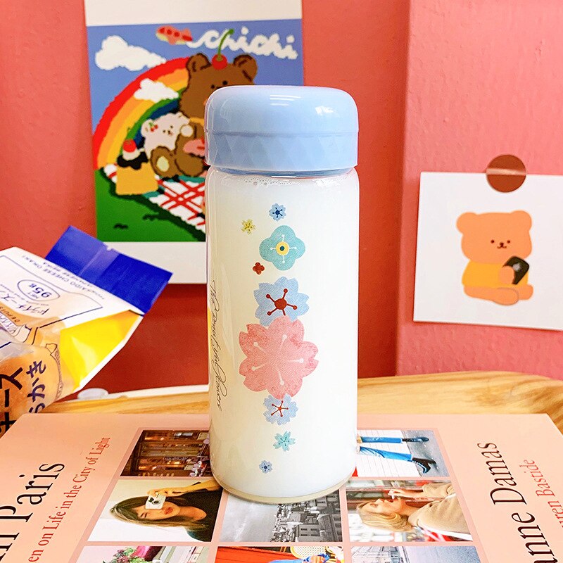 OAPE-taza pequeña portátil de cristal con de flores Kawaii, Mini taza de té portátil para niños y niñas, botella de agua sencilla: Azul