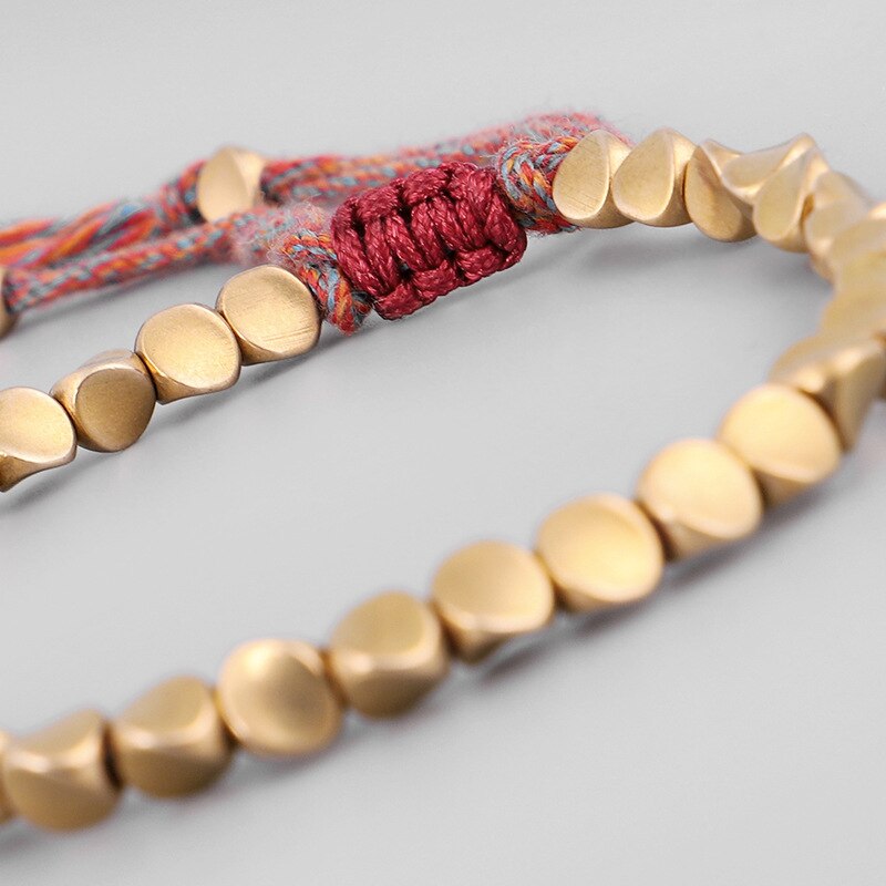 Bracelet porte-bonheur en fil de coton tressé bouddhiste fait à la main, amulette sculptée avec perles en cuivre pour hommes et femmes