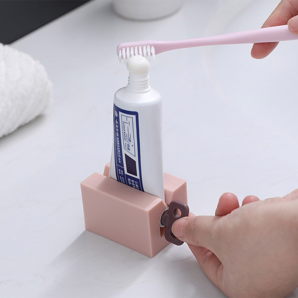 Nouveaux accessoires de salle de bain presse-dentifrice distributeur de pâte à dents presse-Tube nettoyant pour le visage presse support roulant pour enfants