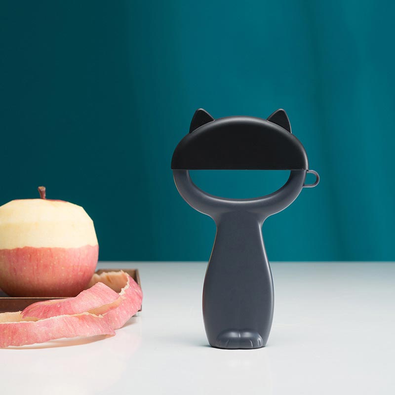 Couteau éplucheur de fruits, dessin animé chat éplucheur de fruits épluchage de melon raboteuse de fruits et légumes