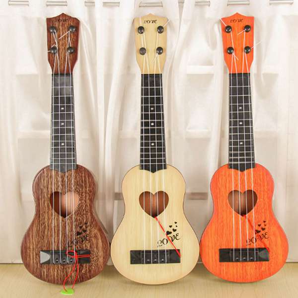 Musikinstrument mini ukulele børn guitar legetøj skole spille spil farve tilfældig