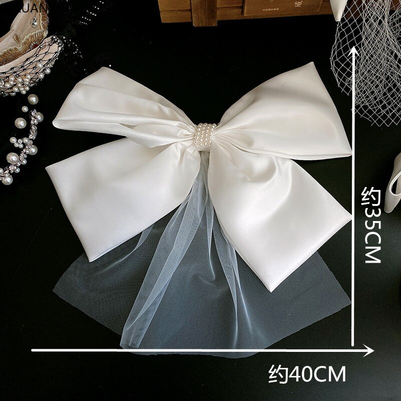 Witte minimalistische witte oversized strik haarspeld sluier die bruidshoofdtooi bedekt bruiloft accessoires