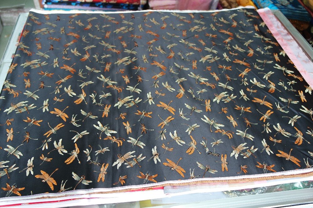 chinese traditional silk brocade fabric black back with yellow and light gold colorful dragon fly dragonfly pattern