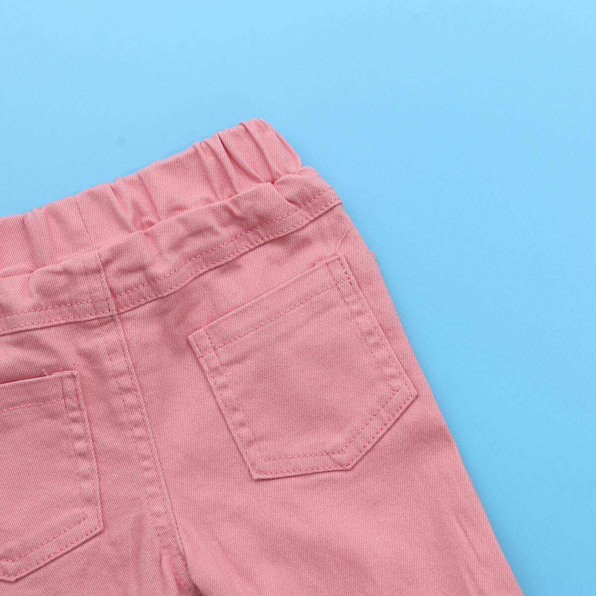 Icute flickor byxor stil jeans utsvängda byxor barn små barn baby barn jeansbotten stövel skurna hål rosa byxor